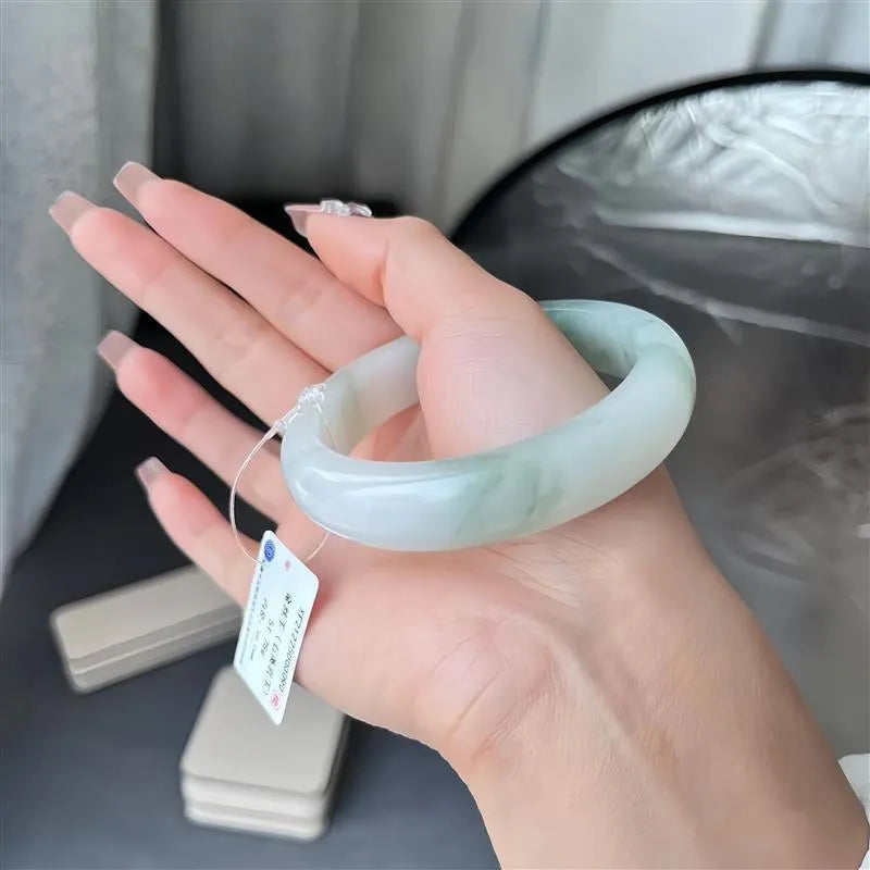 Children's Tian Shan Cui jadeite bracelet with animal zodiac motifs and floating flower inclusions