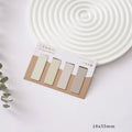 Set of four miniature magnetic bookmarks in soft pastel colours with rectangular design and embedded magnets
