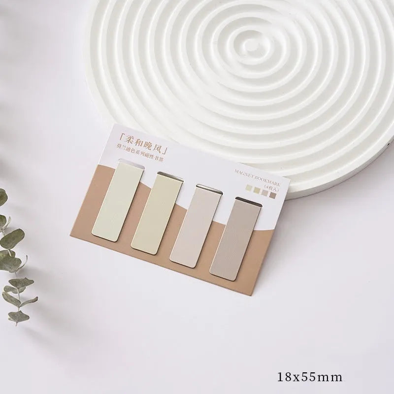 Set of four miniature magnetic bookmarks in soft pastel colours with rectangular design and embedded magnets