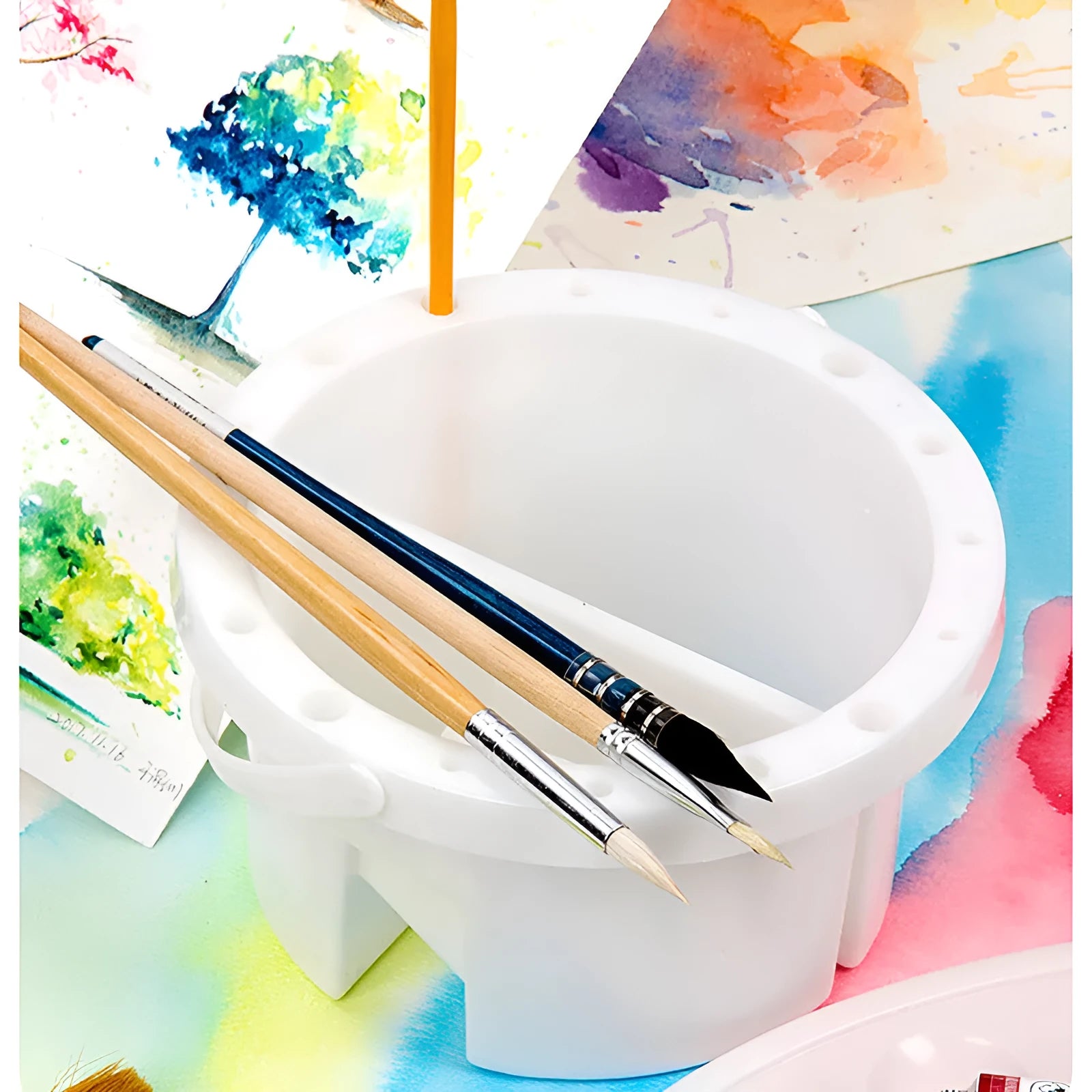 White plastic cylindrical brush holder with a side clip for painting.