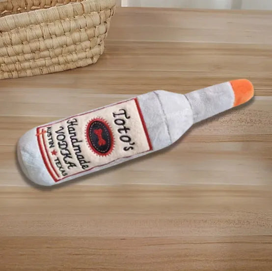 Brown wine bottle shaped plush dog toy with textured molar-like chewing surface