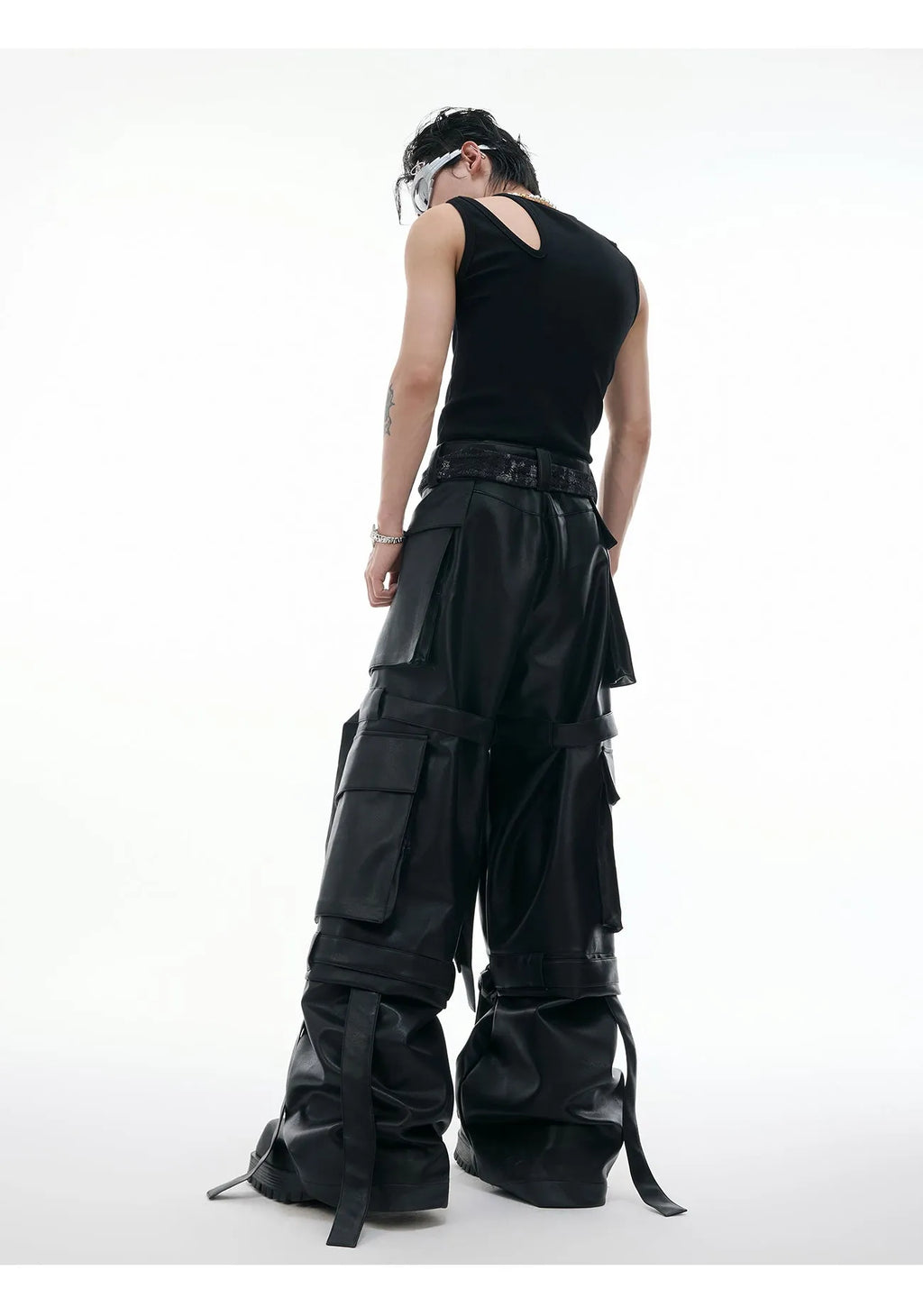Black loose-fit quilted trousers with PU leather ribbon stitching and multiple pockets