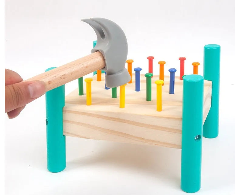 Wooden hammering nail toy with 17 coloured nails, hammer, reverse knock and nail plate, 19 x 13.5 x 16 cm