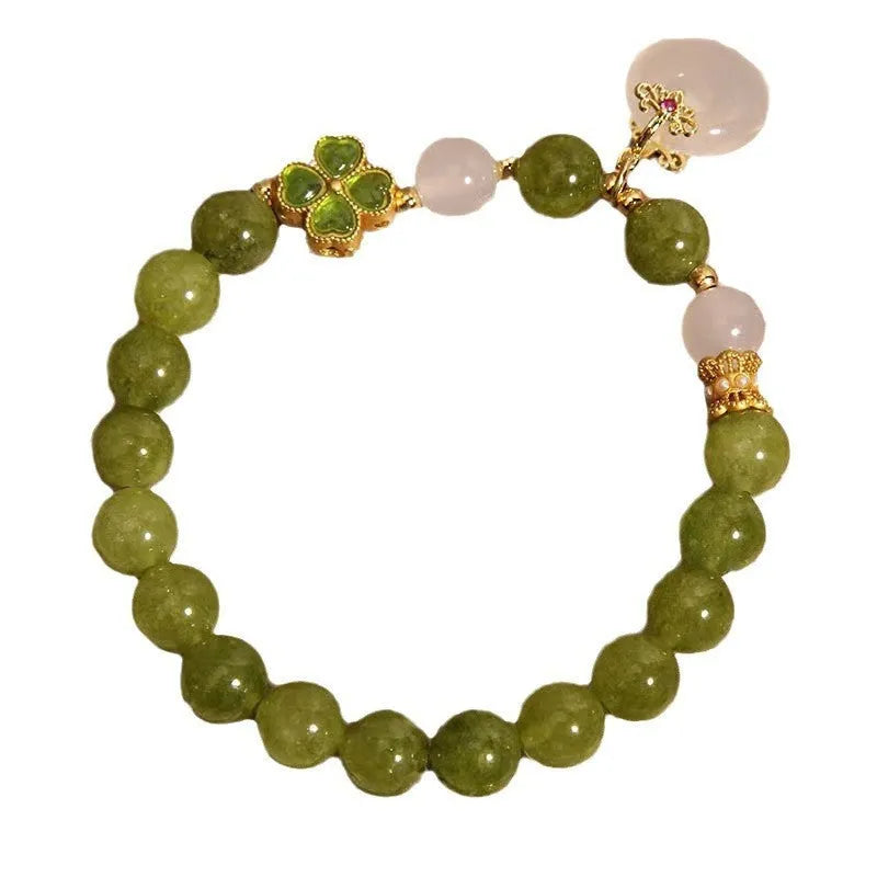 Women's green tourmaline four-leaf clover bracelet with silver electroplated finish and safety buckle clasp.