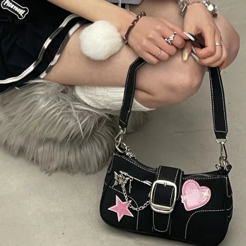 Black PU shoulder bag with bow, stitching and chain details, 25cm x 13cm x 7cm