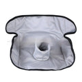Alien-shaped grey car seat protective pad with urine-separation layer on a car seat.