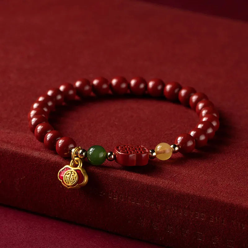Handcrafted cinnabar bracelet with emperor sandstone beads and traditional fu character design in New Chinese style