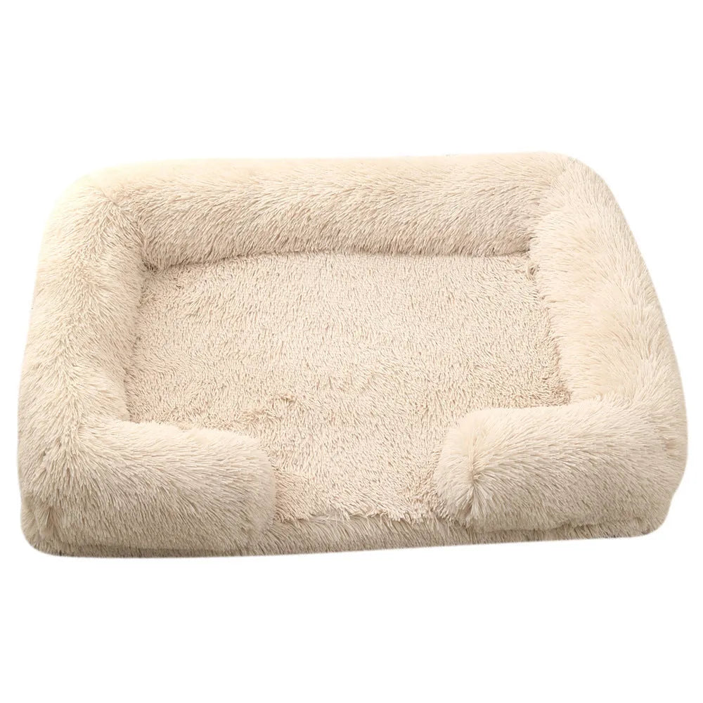 Plush round dog bed in beige brown with raised sides and a removable inner sleeve.