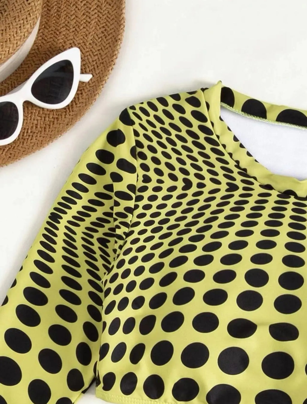 Women's green polka dot three-piece swimsuit set showing top, skirt and bra