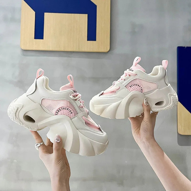 Women's pink sneakers with cross straps, 3-5cm thick sole, and mesh lining for breathable comfort