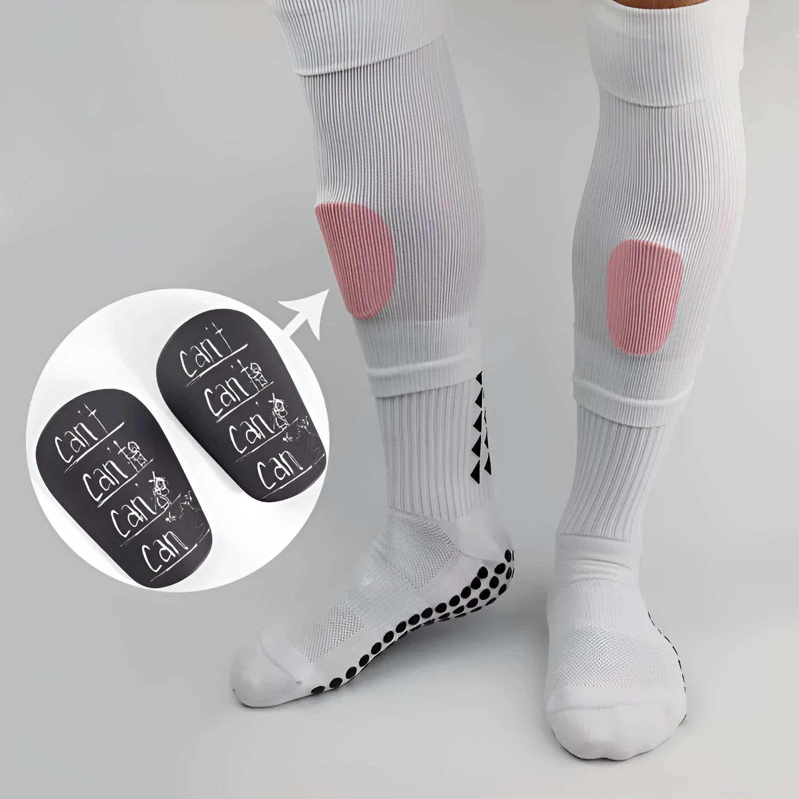 Pair of football shin guards in black colour showing front protective design