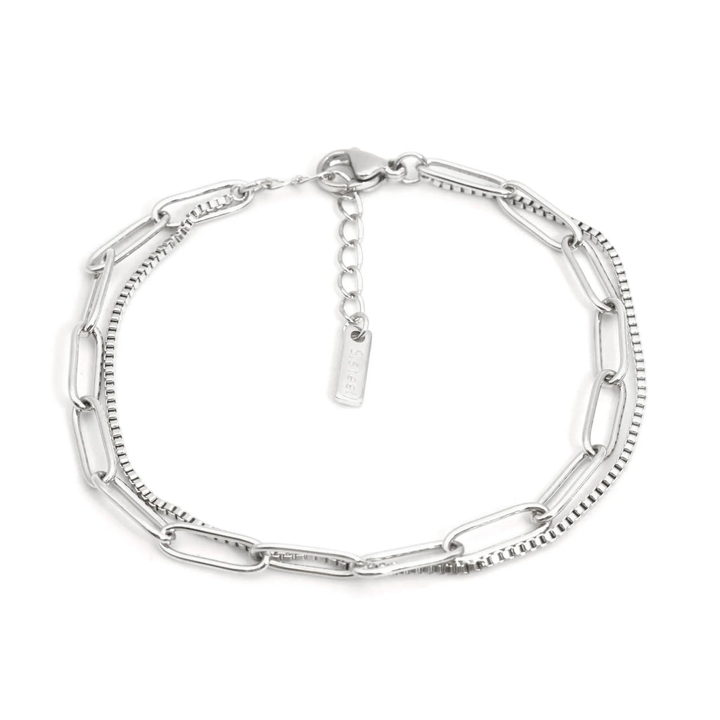 Double layer twin stainless steel bracelet in gold or silver with geometric line design.