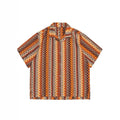 Loose fit ethnic style woven Cuban collar shirt in contrasting colours on a hanger.