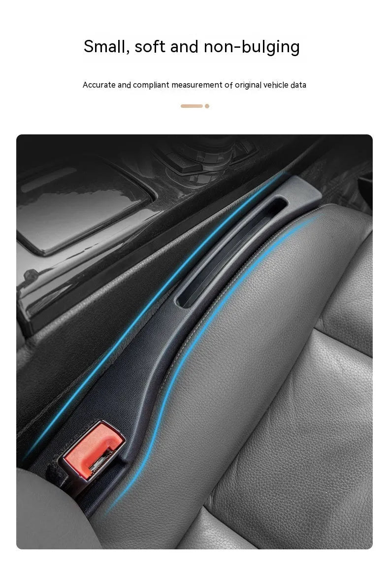 Black plastic storage box with handle placed in car seat gap.