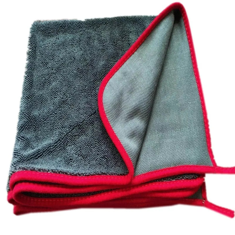 Grey car cleaning and pet bath towel with black hemmed edge, shown with a selection of different size options.