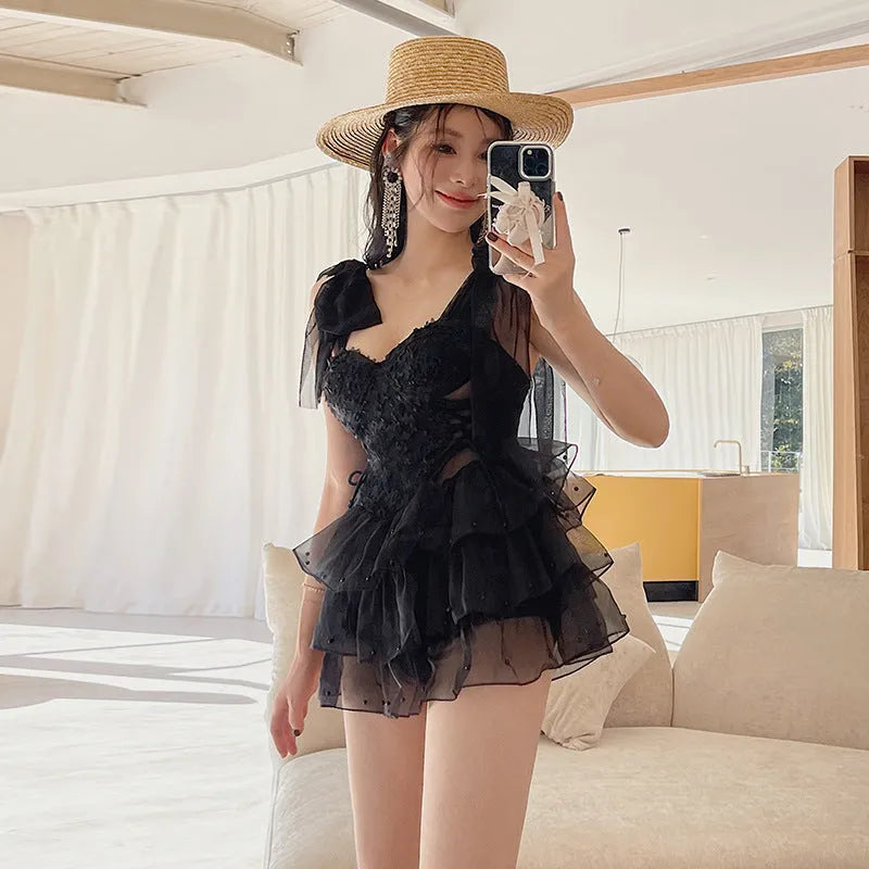 Black one-piece swimsuit with chest gathering and belly coverage, sleeveless design, sizes M L XL