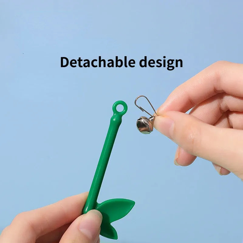 Green interactive cat wand toy with feather and bell attachments for stimulating play