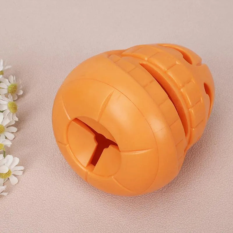 Yellow pumpkin-shaped TPR dog chew toy for aggressive chewers measuring 8.6x11.5 cm