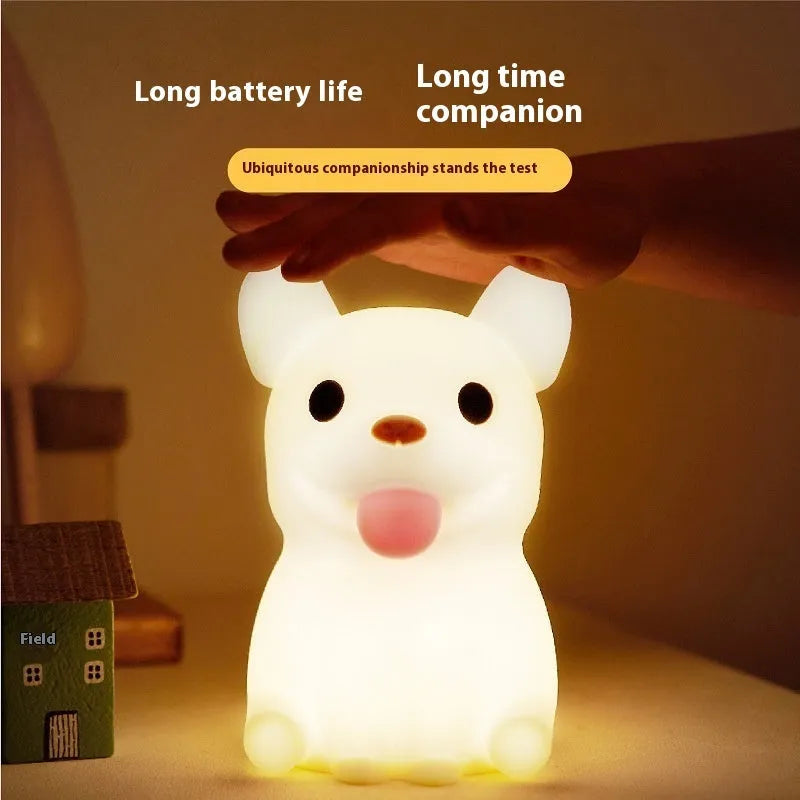 Silicone cartoon bull night light with USB port for charging and dimming controls.