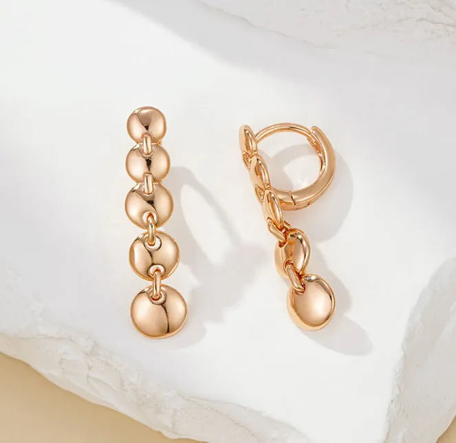 Gold-plated copper circle earrings with hand-woven texture, measuring 6cm in length