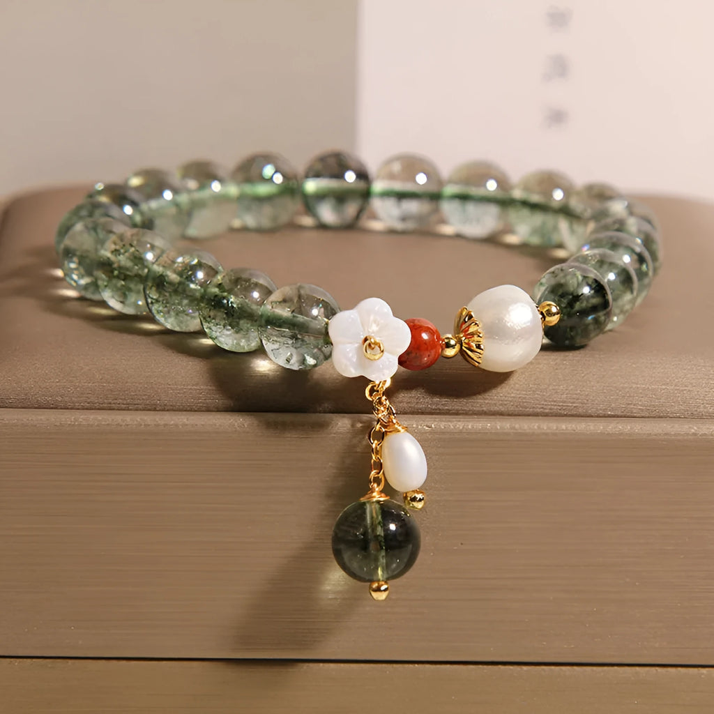 Green phantom quartz crystal bracelet with small bells of Ireland design and shell flower accents