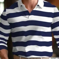 Man wearing a loose-fitting retro style long sleeve pullover top in a solid colour.