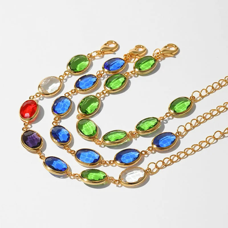 Geometric copper bracelet with blue inlaid glass elliptical design for women.