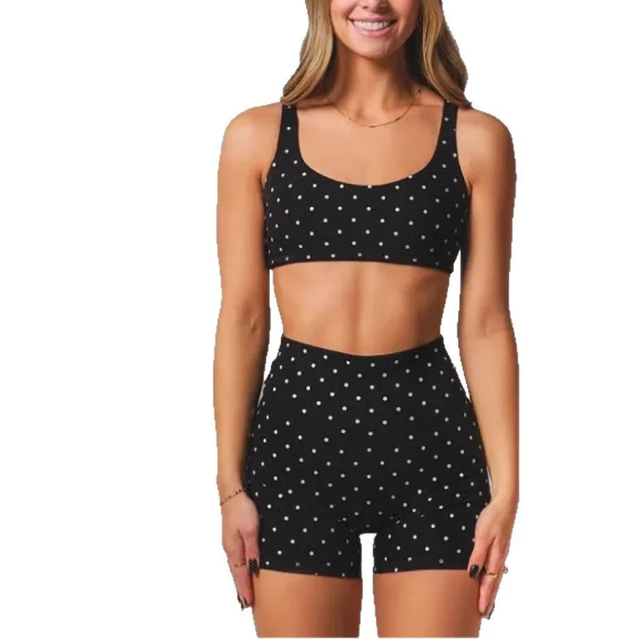 Black wave point two piece swimsuit set with sleeveless top and fifth pants, sizes XS to 2XL