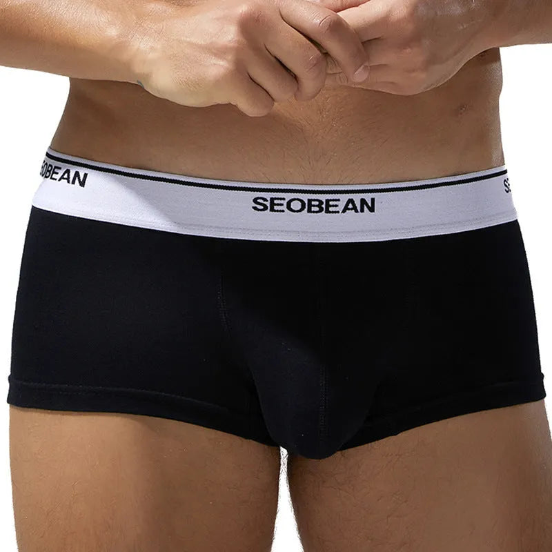 Men's cotton boxers in low waist design showing solid colour options