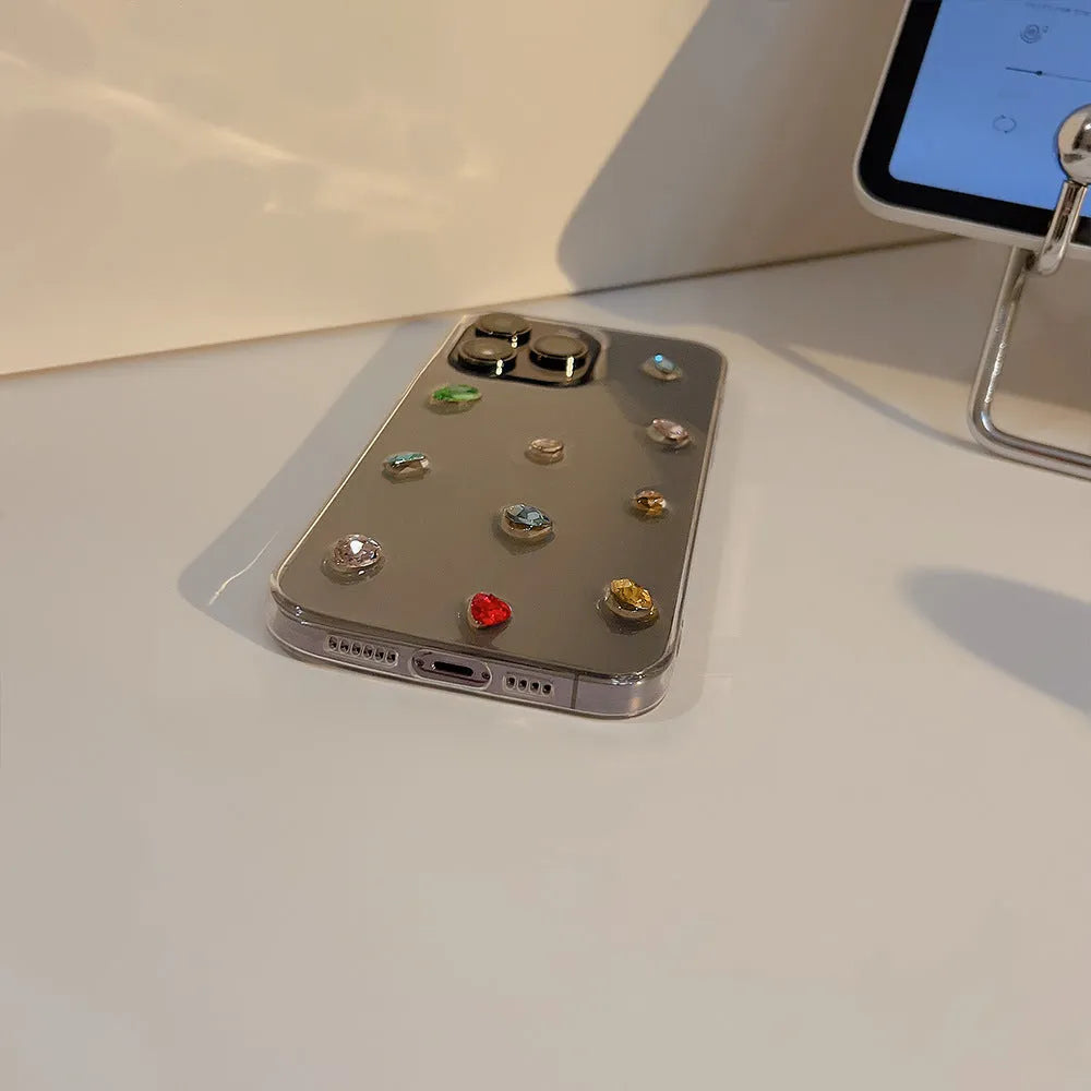 Crystal epoxy iPhone case with colourful rhinestones and love heart design on transparent TPU cover