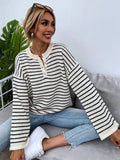 Black and white striped women's long-sleeve viscose top with drop-shoulder sleeves and a button detail.