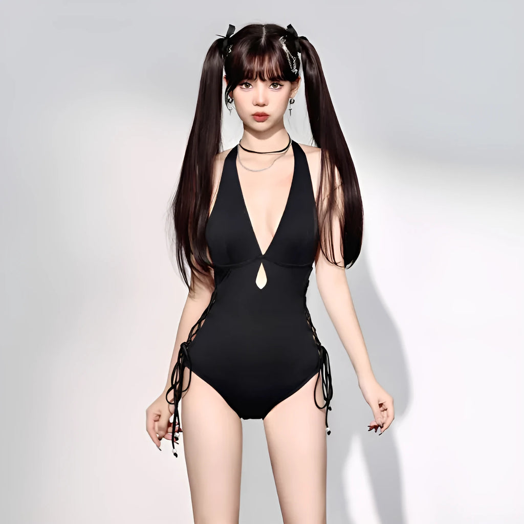 Black women's one-piece swimsuit with V-neck and hollow strap design on a mannequin