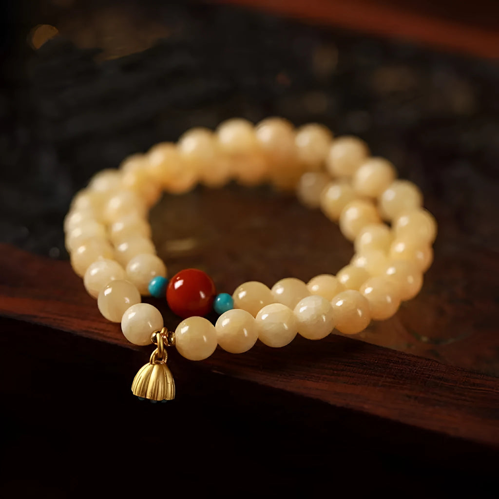 Hand-woven yellow topaz double ring bracelet with lotus seedpod beads for women.