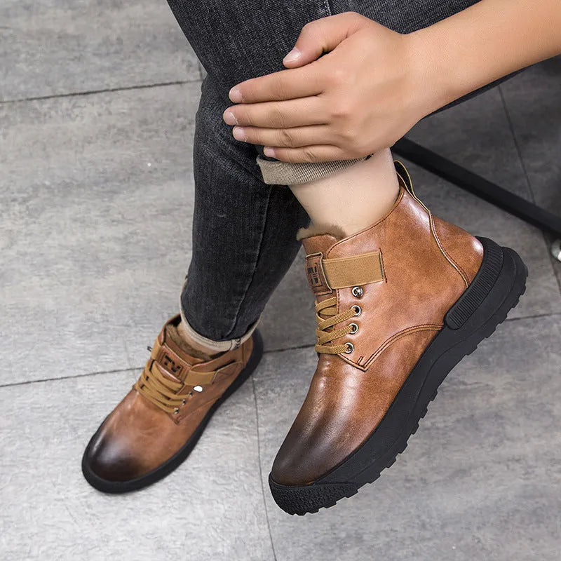 Black Martin high-top platform boots with velvet accents and a thick rubber sole on a neutral background