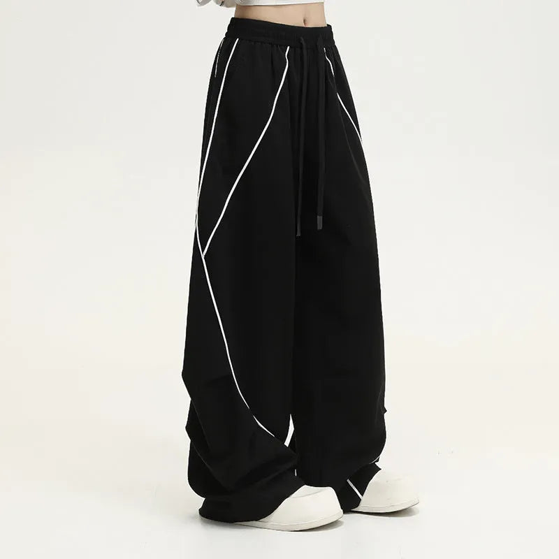 Black pleated wide-leg sports trousers with striped pattern and mid-waist design