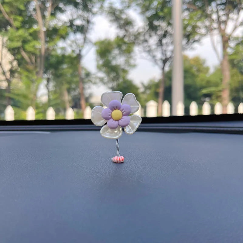Plastic car swing decoration measuring 5cm tall in blue, green, pink, purple, and yellow colour options
