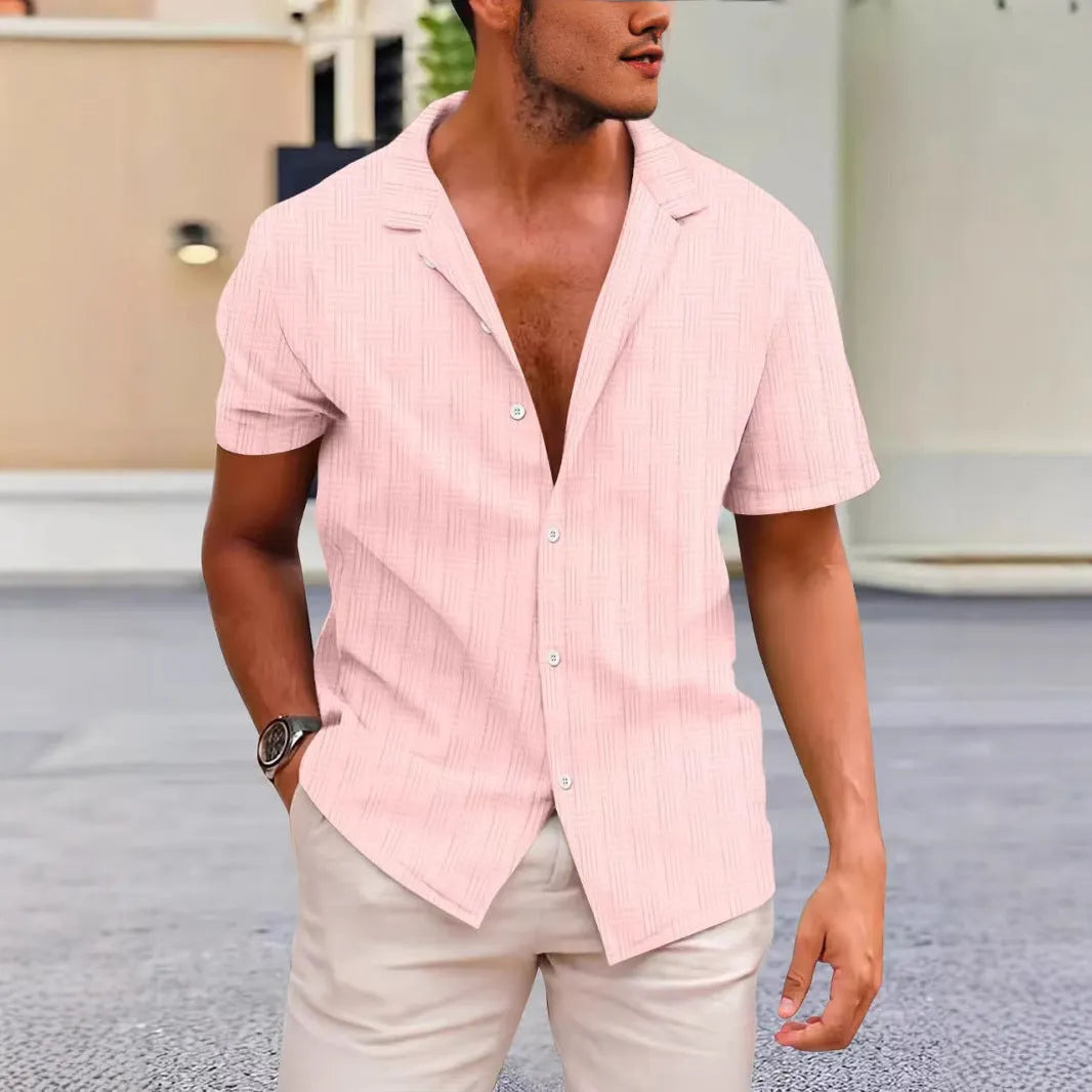 A corduroy short sleeve button shirt in a solid colour, shown in a British style cardigan fit.