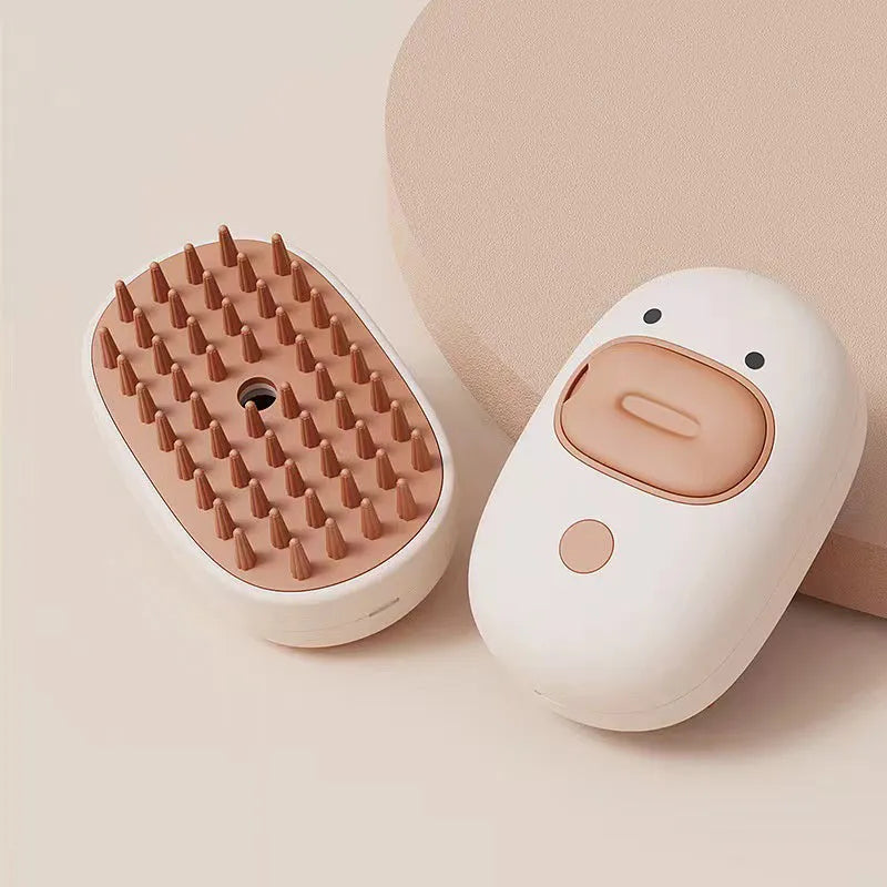 White or yellow Cat Steam Brush with silicone teeth and rechargeable spray for grooming dogs and cats
