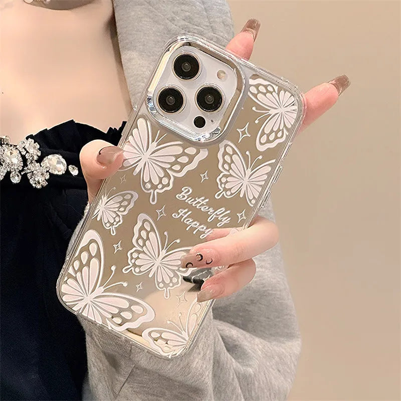 Transparent three-in-one mirror phone case for iPhone with detachable bracelet, showing bow decoration.