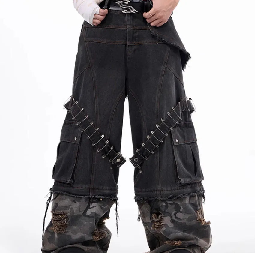 Men's grey jeans with camouflage pattern splicing and pin ribbon details on the legs.