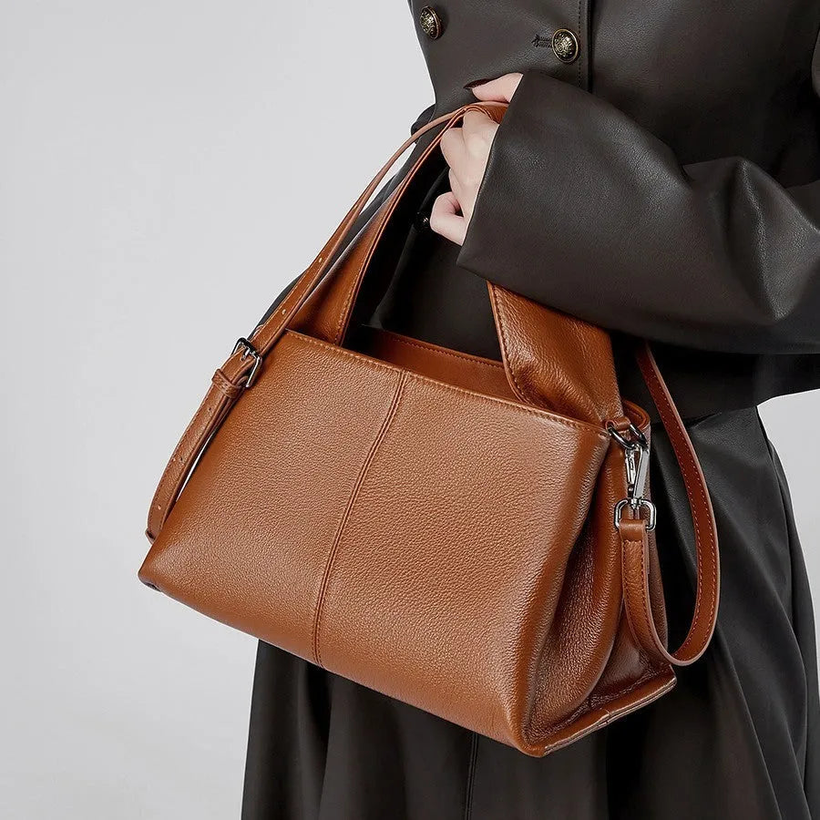 Women's genuine leather messenger bag in horizontal square shape with double shoulder straps and organised compartments