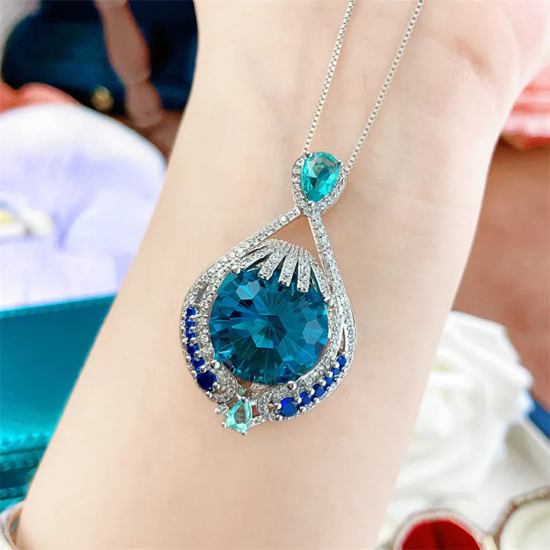 Women's geometric pendant necklace with bright blue fireworks-cut crystal and electroplated water wave chain