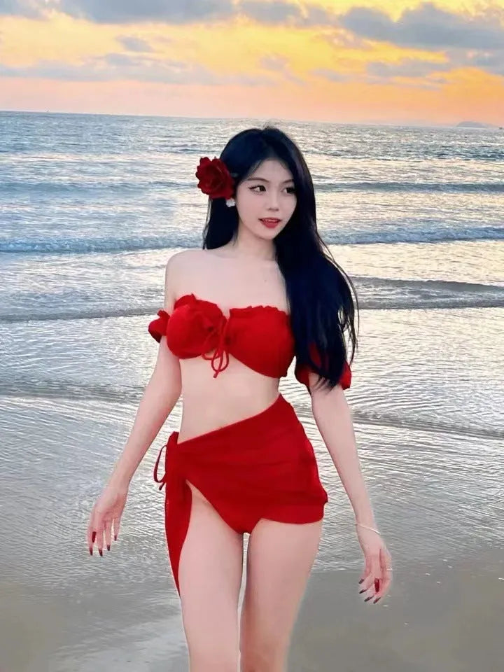 Red women's bikini swimsuit with puff sleeve skirt briefs on hanger