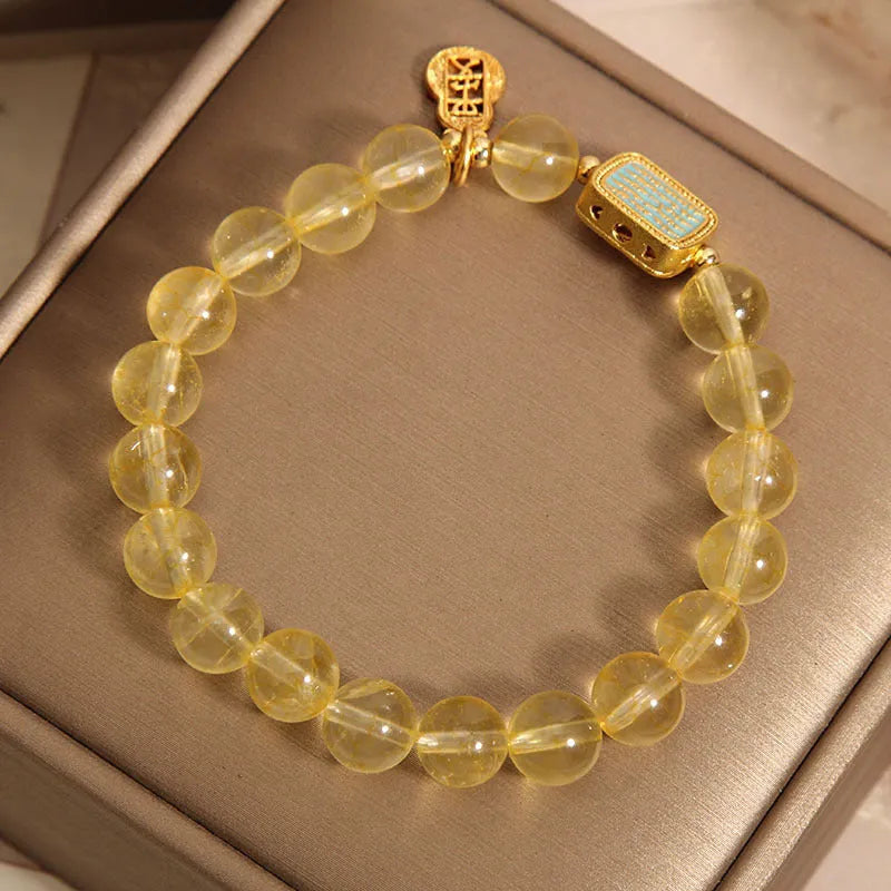 Yellow citrine crystal women's bracelet with rhinestone detailing on wrist