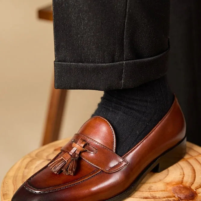 British-style tassel loafers in polished leather with rubber sole and pigskin lining