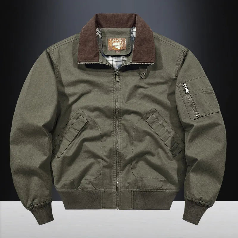 Men's beige washed cotton baseball-style flight jacket shown on a hanger.