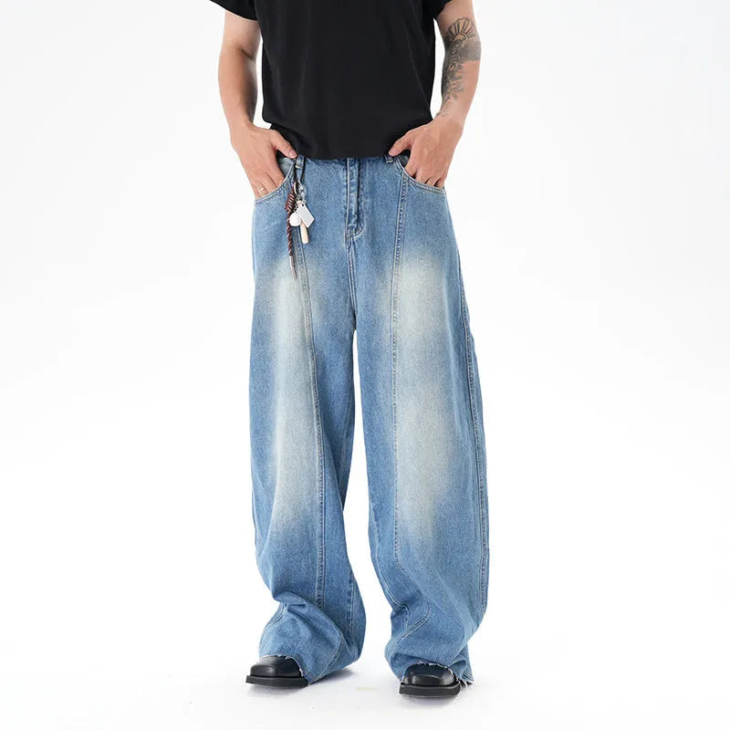 Light blue vintage washed wide leg denim jeans with a zipper fly on a mannequin.