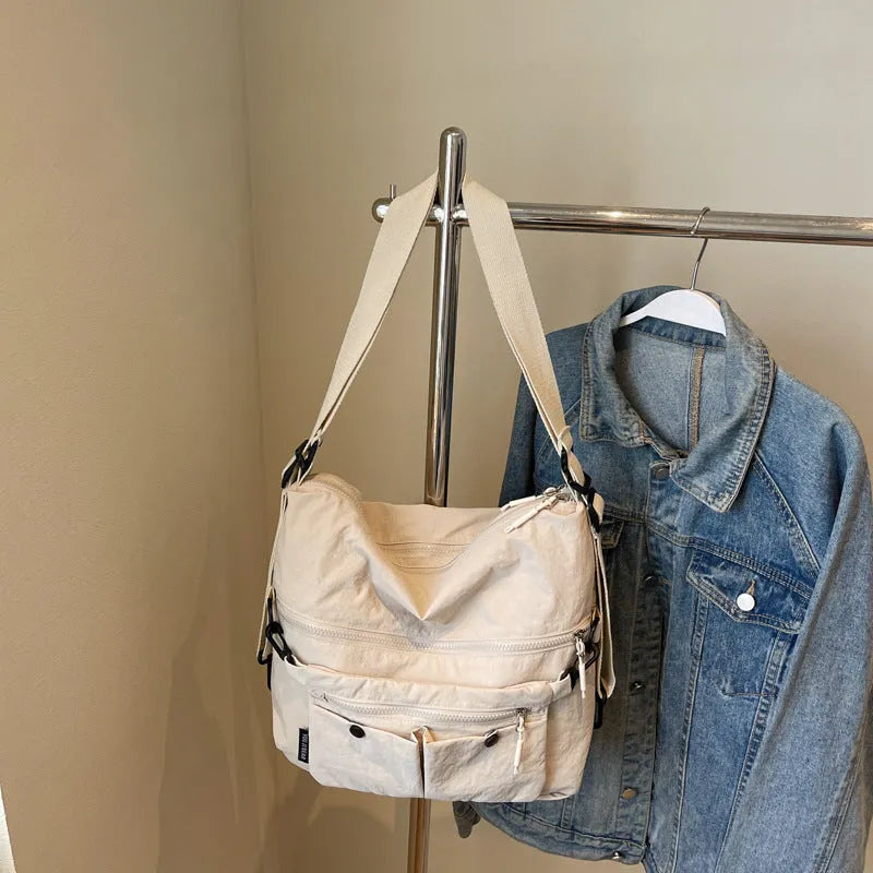 Women's soft nylon crossbody bag with sandwich zipper pocket and adjustable shoulder straps