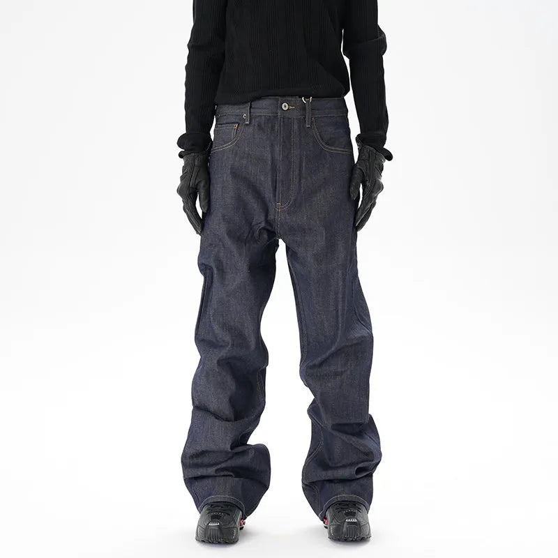 A pair of dark blue loose straight-leg men's jeans on a plain background.
