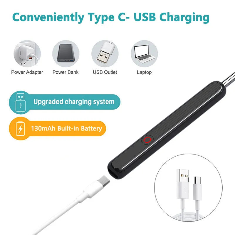 Black and white wireless otoscope ear cleaner with camera, LED light, and spoon heads on a table.